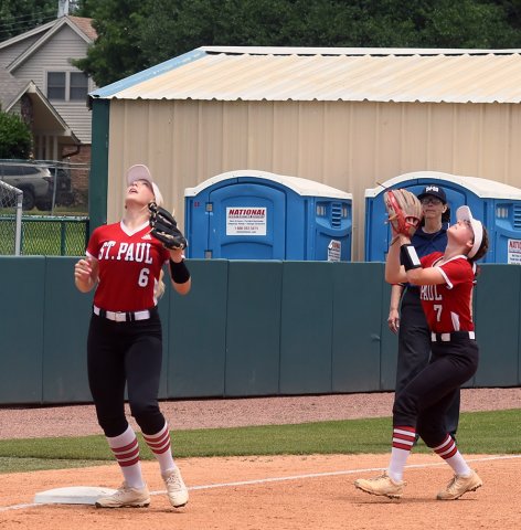 Third baseman Emery Kennedy (left) and shortstop Presley Tuch (right) both converge on a Sacred Heart fly ball during the second inning. Tuch made the catch for the out. Photo by Mark Lube.