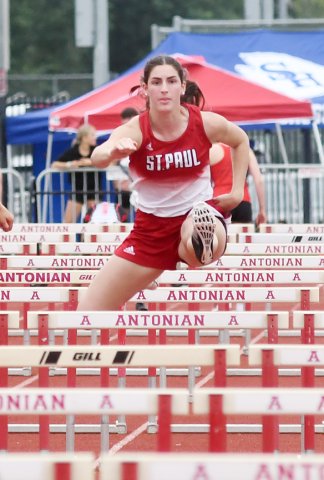 Ashlin DeSarro (right) won the 100-meter hurdles with 17.3 seconds and was second in 300 hurdles with 50.39 Thursday at the regional meet in San Antonio. Photo by Mark Lube.