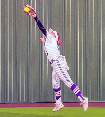 Hailey Radicke stretches out to catch a fly ball in the regional-final series against Burton. She had three putouts total in the two games. Photo courtesy of Howard Esse.