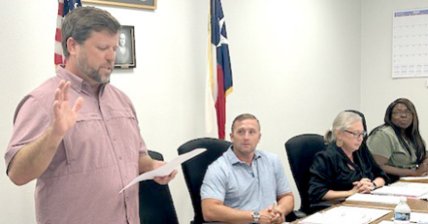 PICTURED IS PETER MURPHY TAKING THE OATH OF OFFICE FOR PLACE #4