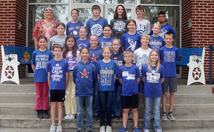 The Sacred Heart Catholic School 5th graders recently participated in the St. Jude Math-A-Thon program and raised $2,358.25. The amount raised  goes toward helping kids who battle cancer and other deadly diseases. During the past years, the 5th grade classes have been involved in the program and have raised a total of over $14 thousand. The photo shows this year’s 5th grade class along with their teacher and coordinator of the school’s participation, Doris Fenner. Photo by Ruth Barton