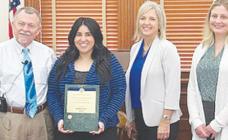 DeWitt County Commissioners presented a certificate of compliance for Desirae Poth-Garibay from the County Treasurer's Association of Texas. From left to right are DeWitt County Judge Daryl Fowler, County Treasurer Poth-Garibay, Melissa Terry, and Elizabeth Bonorden from Harrison Waldrop, and Uherek LLP.