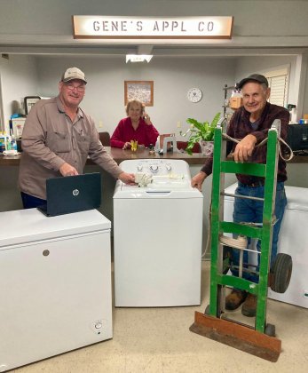 (From left)  Ronald Drozd, Lucille Drozd and Robert “Jack” Etzler pose in Gene’s Appliance Co. 