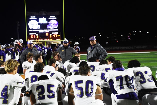 Head coach Daniel Boedeker says a few words to the team after the game. Photo by Mark Lube.