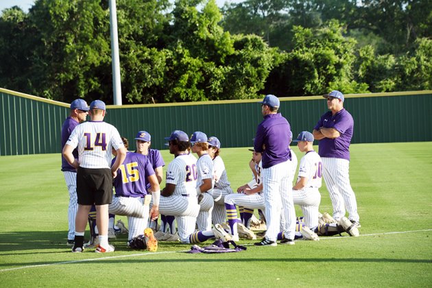 The Comanches hold a pre-game meeting prior to Game 1 on May 24. Photo by Mark Lube.