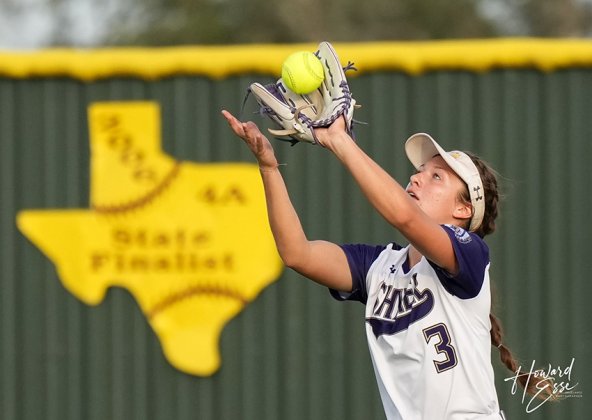 Senior centerfielder Riley Rainosek secures a fly ball. She had three putouts in the game. Photo courtesy of Howard Esse