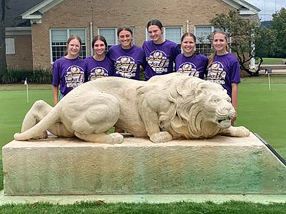 Behind the statue at Lions Golf Course, from left is  Grace Migl, Lauren Faldyn, Chelsea Whiddon, Morgan Lenehan, Brianna Sofka and Megan Winkenwerder. Photo courtesy of Michelle Winkenwerder.