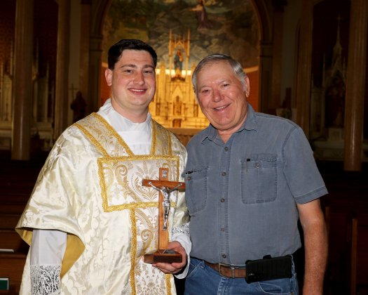 Mr. Picha presented the crucifix too the soon-to-be priest at his home parish here in Shiner, just a days ago during a photo shoot with Michelle Price, who incidentally took portraits of Ryan when he entered the seminary and, a decade later, just before he became a priest.