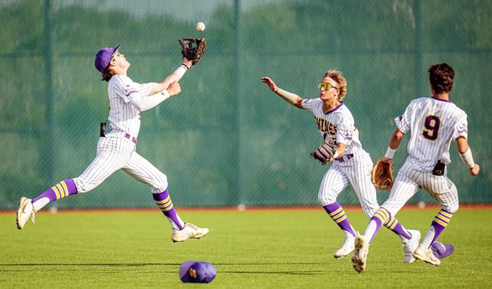 Shortstop Ryan Peterson reaches for a flyball while center fielder Landyn Pohler (center) and second baseman Carson Schuette also converage on the ball in the second game of Shiner’s regional final series against Johnson City last week in Marion. Shiner won 5-2 and 1-0 to play in their third consecutive state tournament. They played New Home yesterday (Wednesday) evening in the state semifinals. Photo courtesy of Howard Esse. 