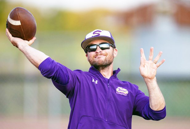 Shiner assistant coach Connor Stefka displays his football throwing ability prior to the start of Shiner’s game at Industrial. Photo by Howard Esse.
