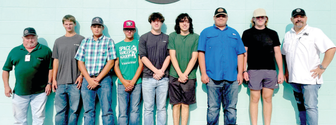 Seven Hallettsville High students began attending the Mid-Coast Construction Academy in Victoria on Aug. 9. The academy is a pre-apprenticeship program that provides hands-on lab training and related classroom instruction in electrical, plumbing and HVAC areas. From left are Ronnie Rehm, Hallettsville ISD driver, students Payten Wenske, Coltyn Needham, Kaden Grahmann, Kole Pustejovsky, Garett Weir, Frankie Howell, Brady Copley, and the Director of the Mid Coast Construction Academy, Matt Hilbrich. 