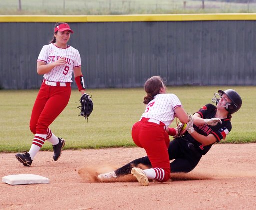 St. Paul shortstop Presley Tuch (middle) successfully tags out the Plfugerville Concordia base runner on a second-base steal attempt. Second baseman Stefany Pokluda backs up the play. Photo by Mark Lube.