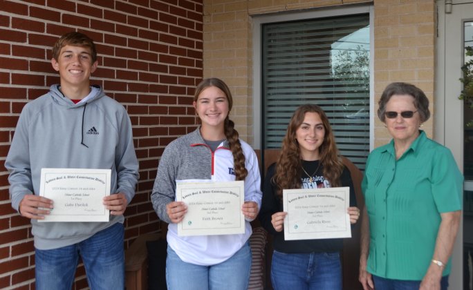 Lavaca Soil and Water Conservation District 13 selected its school wide 14 and over essay winners from Shiner Catholic School, who include from left Gabe Darilek (1st), Faith Brown (2nd), Gabriela Rivas (3rd) and LSWCD secretary, Dorothy Henke. Photo by Jimmy Appelt
