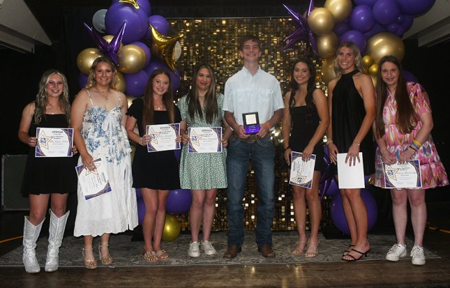 2025-2026 Cheerleader Beau. Beau is Chase Malinovsky (fourth from right). Also shown is MaKenna Pish (left), Olivia Akin (second from left), Kacy Kramer (third from left), Bianca Rainosek (fourth from left), Tawni Shelton (third from right), Addy Siegel (second from right) and Valerie Bordovsky (right). Photo by Mark Lube.