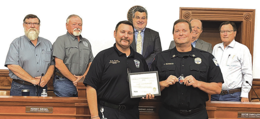 County EMS Captain John Schultz was recognized and presented an accommodation for assisting the Fayette County EMS with an incident last week. The presentation took place at Monday’s Lavaca County Commissioners’ Court meeting. Front from left are Lavaca EMS chief Michael Furrh and captain John Schultz. Back row are court members including commissioners Dennis W. Kocian, Kenny Siegel, Judge Keith Mudd, and commissioners Wayne Faircloth and Edward Pustka. Photo by Lavaca County EMS assistant chief Tim Decker