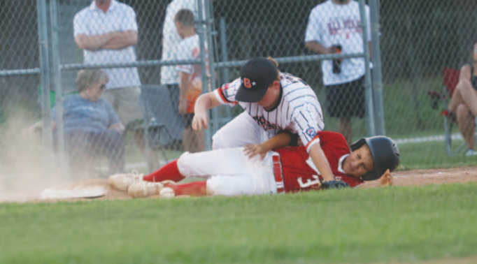 Photo by Chuck Grafe Brax Threadgill slides safely into third during the victory over Gonzales.