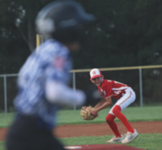 Photo by Chuck Grafe Third baseman Caston Dworsky eyes first base after fielding a ground ball.