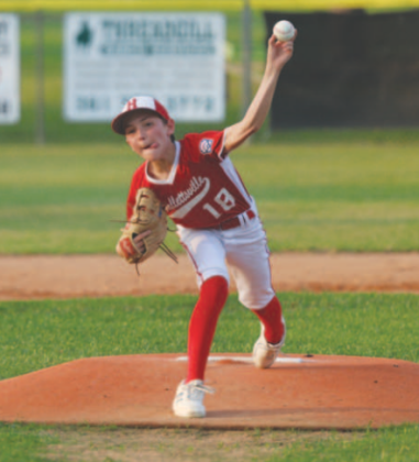Photo by Chuck Grafe Holt Thigpen delivers a pitch during the game here Sunday evening..