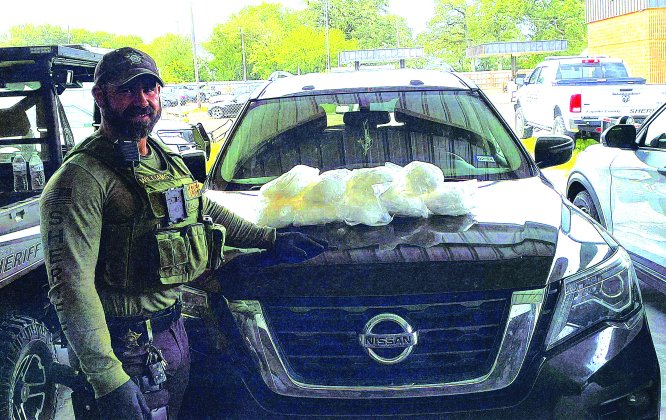 Deputy Williams with seized drugs