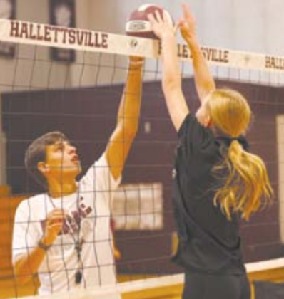 Photo by Chuck Grafe Coach Rylan Schindler works with Heidi Grahmann at Monday afternoon’s practice.