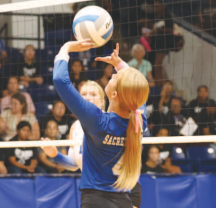 Photo by Chuck Grafe Kenzie Chance sets in the victory over Rice Consolidated. Kenzie had nine aces in the match.