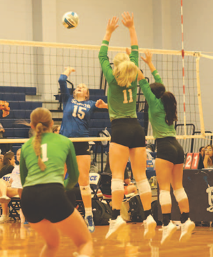 Photo by Chuck Grafe Piper Hawkins (15) on the attack vs. Boling Friday.