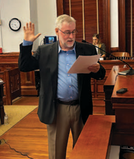 Chris Ulcak takes the oath to serve  as the Lavaca County Pct. 2 Justice  of Peace at the Tuesday, Sept. 15  commissioners’ court meeting. Coun ty Judge Keith Mudd conducted the  swearing-in ceremonies. Photo by  Jimmy Appelt