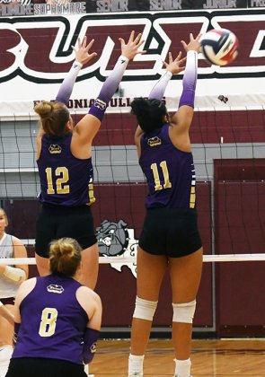 Harlee Sevcik (left) and Kiera Curtis at the net against Flatonia. Photo by Mark Lube.