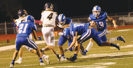 Photo by Chuck Grafe Trent Sevcik makes the tackle on Westbury quarterback Jackson Carr