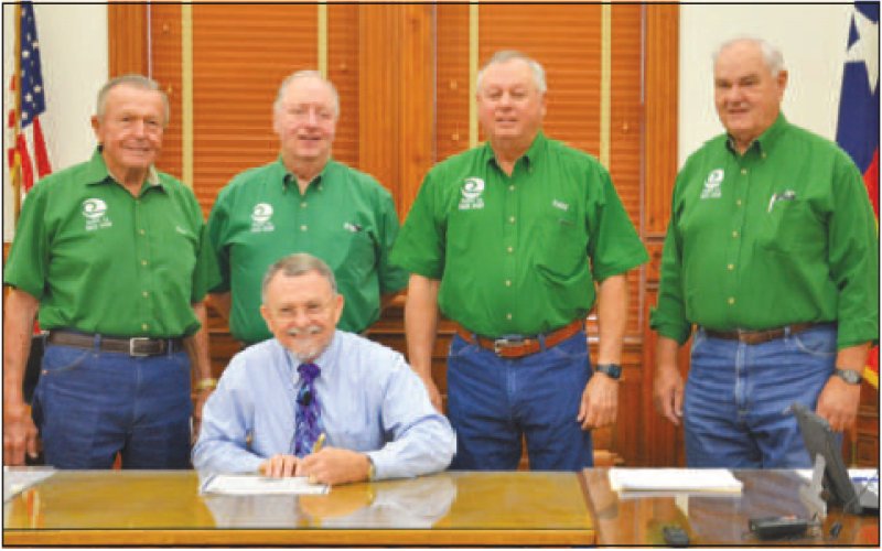 A proclamation was signed designating Soil and Water Stewardship Week, April 24- May 1. Pictured is Judge Daryl Fowler (seated). Pictured in the back row from left to right are directors Clem Waskow, Dwain Harbers, Finley Frels, and Leo Heinemann.