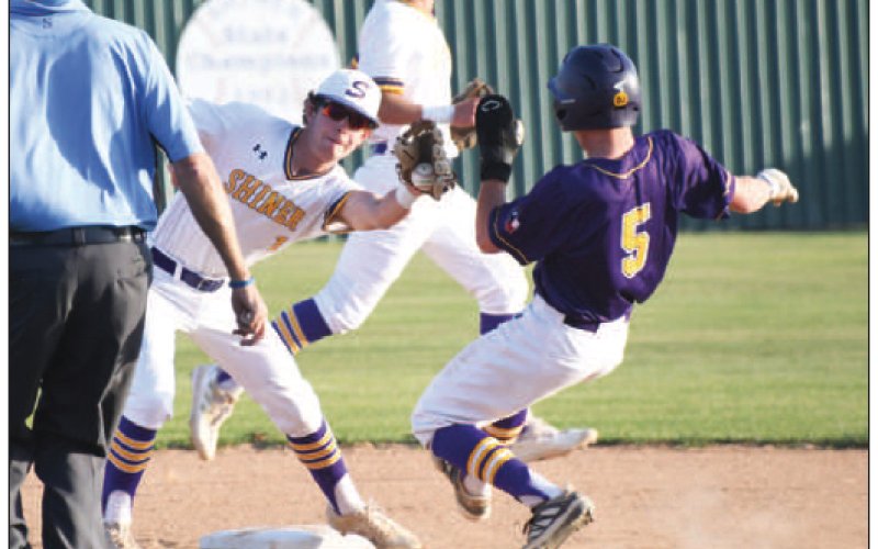 Shiner second baseman Jace Moeller attempts a tag out on a steal attempt by Weimar’s Brady Henke with shortstop Drew Wenske backing up the play Photo by Mark Lube.
