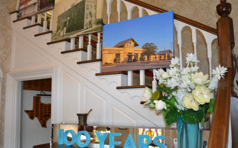 Photos from each YCH location line the stairway at the Yoakum Heritage Museum entrance.