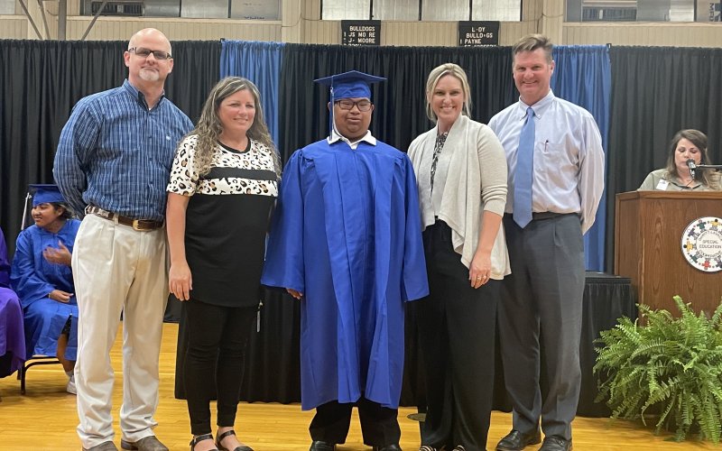 Israel Vasquez of Yoakum ISD poses while being celebrated as a graduate in the Yoakum High School Blue Gym on May 20.