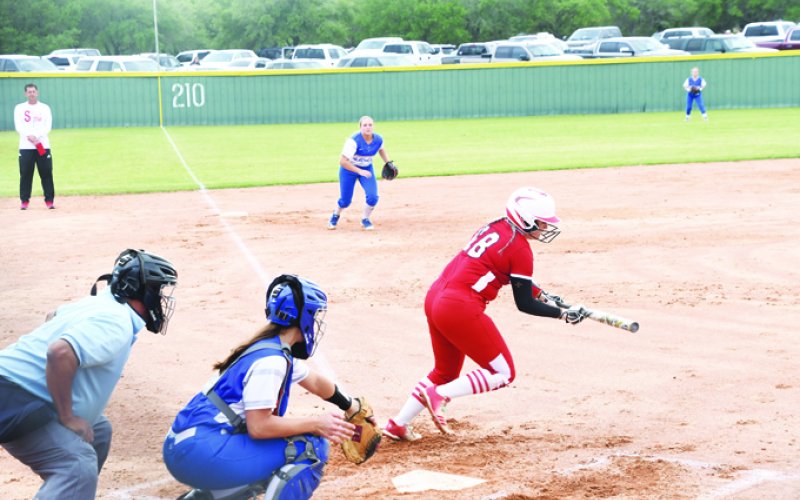 St. Paul senior Seryna Garza attempts a bunt in the Lady Cardinals’ 5-4 home win against rival Sacred Heart Indianettes on April 26 at the Shiner Starplexe. Garza scored one run. Photo by Mark Lube.