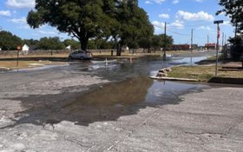 Water flooded the intersection of W. May Street and Front Street last Friday afternoon after a water main creaked.  Contributed Photo.
