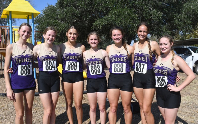 28-2A 2022 Varsity girls team champions Shiner. From left is Amelia Pohler, Callie Chrismon , Brinley Ramirez, Hayleigh Burns , Riley Rainosek , Erin Pustka and Molly Kollaus . Photo by Mark Lube.