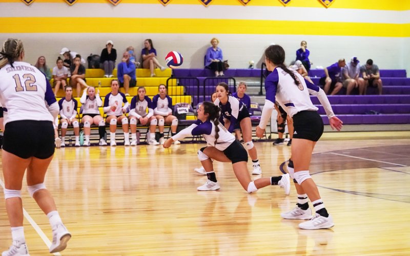 Riley Rainosek attempts to dig out a ball in Saturday's match against Schulenburg. Photo courtsey of Photos by Lori Raabe.