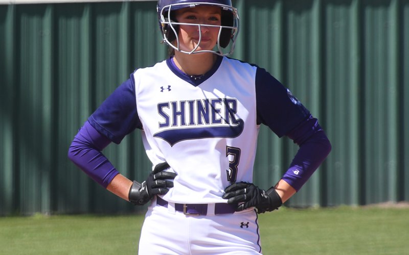 Riley Rainosek and the Shiner softball team are all smiles after three more district wins including a 27-0 win over Bloomington at home on Monday. Photo by Mark Lube.