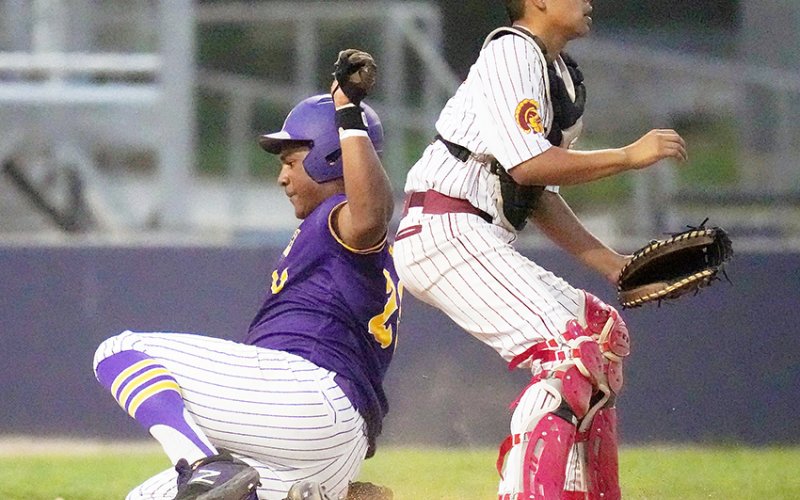 Keenan Hailey safely slides into base during Shiner’s bi-district series with Charlotte last Friday at St. Mary’s University. Hailey got three hits, scored four runs with three RBIs and a triple in the series. Photo courtesy of Howard Esse.