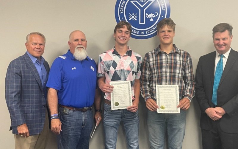 The school board honored members of the Academic All-State basketball team at their Monday night meeting. Pictured from left to right are Board President Glen Kusak, Coach Gary Garvin,YHS seniors Austin Novasad and AJ Adamek, and Superintendent Tom Kelley