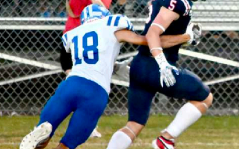 Clayton Janak (12) makes a tackle. Melissa Kutac/Tribune-Herald