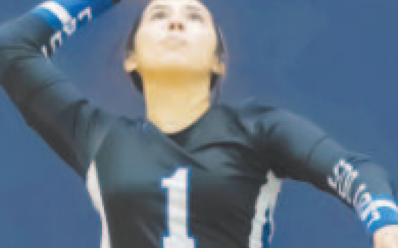 Madison Gonzales (1) serves the volleyball against Poth. Photo courtesy of Raymond Rosas.