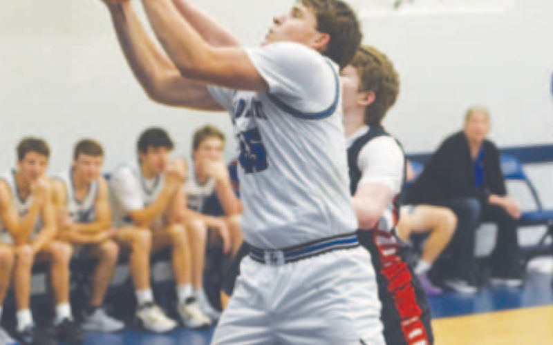 Lance Barton comes away with a rebound in the rout of Cedar Park Summit. Chuck Grafe/Tribune-Herald