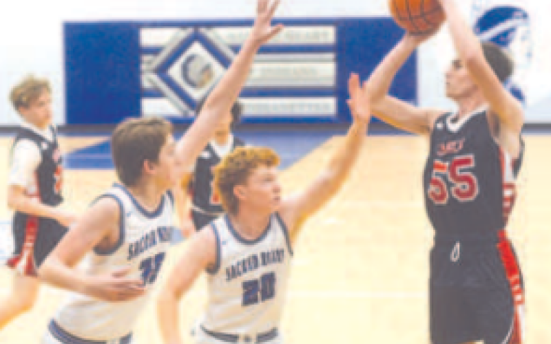 Brody Etzler, left, and Klayton Chance (20) defend in the Jan. 4 game with Cedar Park Summit. Chuck Grafe/Tribune-Herald