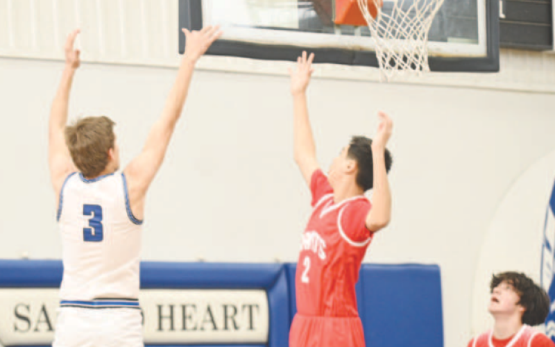 Andrew Steffek shoots and scores in the first period. Chuck Grafe/Tribune-Herald