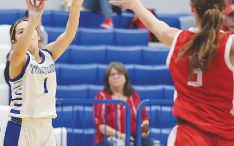 Madison Gonzales takes a shot at the basketball game on Jan. 23 against the Lady Cardinals. Photo courtesy of Raymond Rosas.