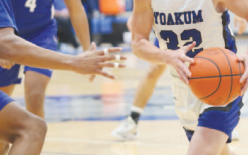 Clayton Hlavac (32) moves around a Blue Raider towards the basketball net. Photo courtesy of Raymond Rosas.