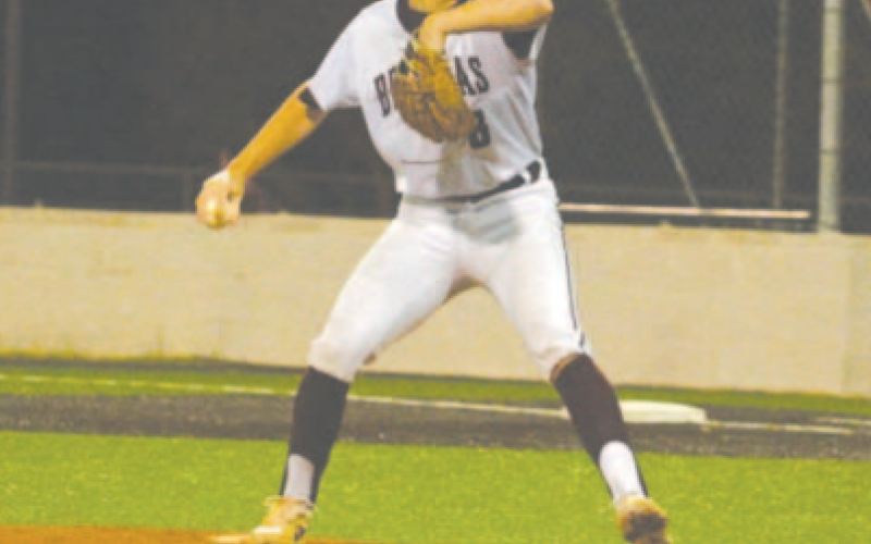Tanner Cliffe throws the first pitch of the season Monday night. Chuck Grafe/Tribune-Herald