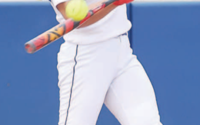 Madilynn Steinmann connects with a pitch at the game against Edna. Photo courtesy of Raymond Rosas.