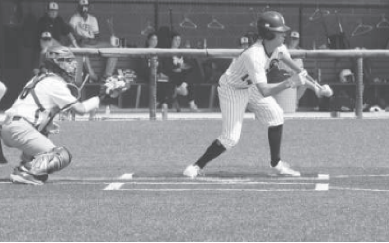 Kellen Mechura attempts a bunt in Friday’s Rice Consolidated game. Chuck Grafe/Tribune-Herald